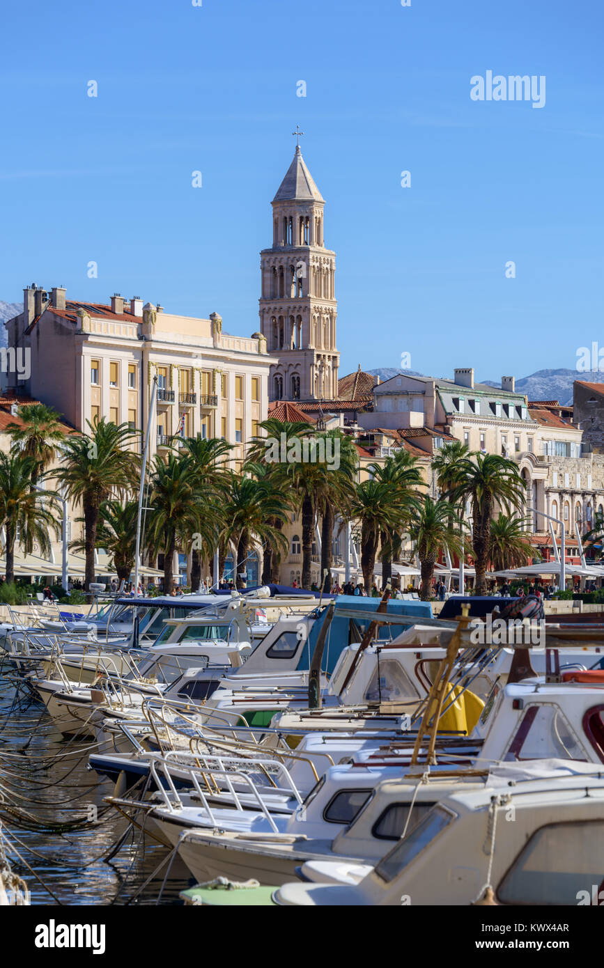Fishing boats near Riva domniated by Cathedral Bell Tower, Croatia Stock Photo