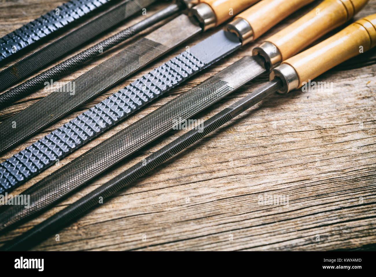 Old hand tools on a wooden background Stock Photo