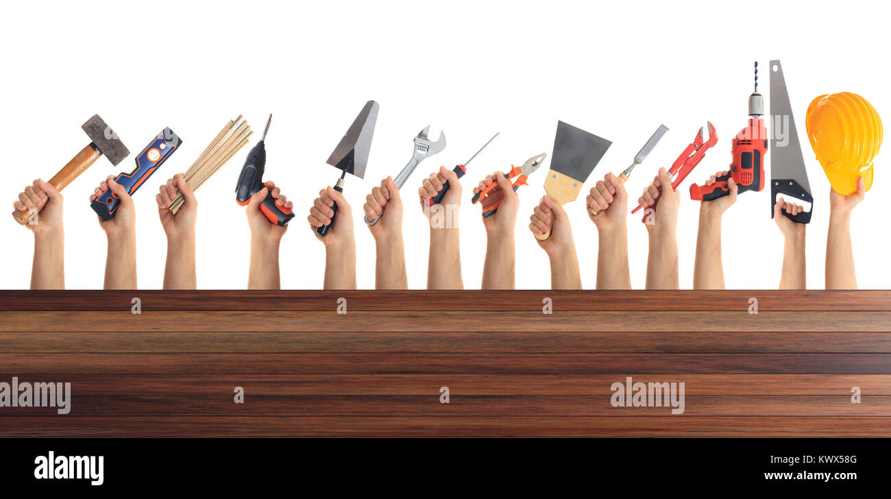 Hands holding hand tools on white background Stock Photo - Alamy