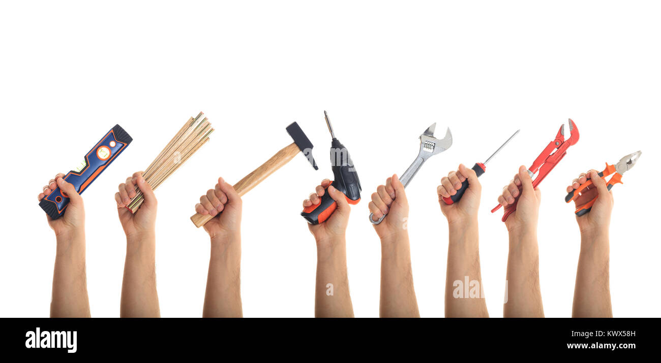 Hands holding hand tools on white background Stock Photo - Alamy