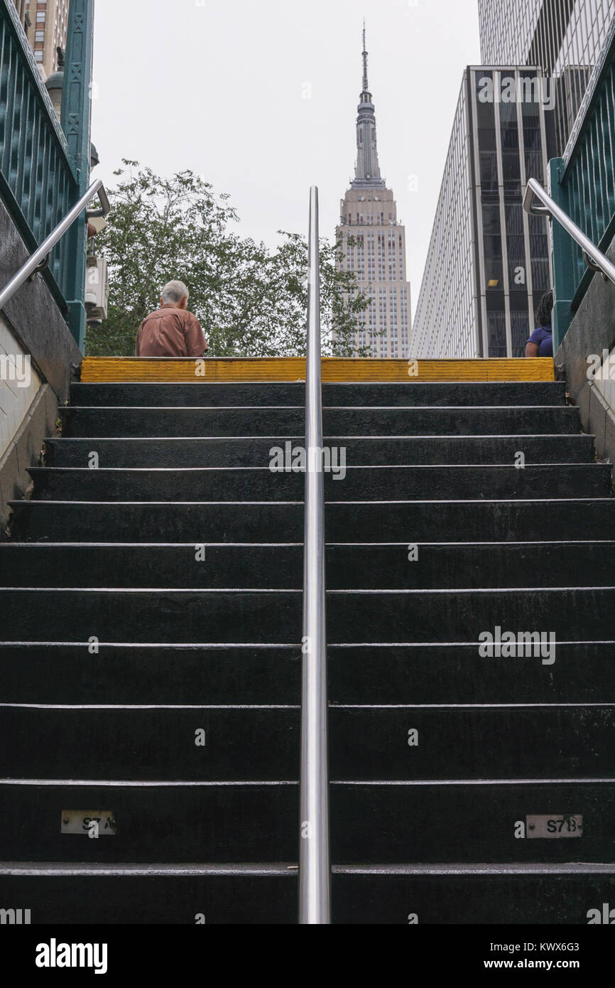 Empire State Building as seen from subway station staircase on 34th street in New York City. Stock Photo
