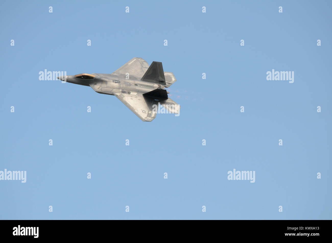 F22 Raptor fight jet against a clear blue sky Stock Photo