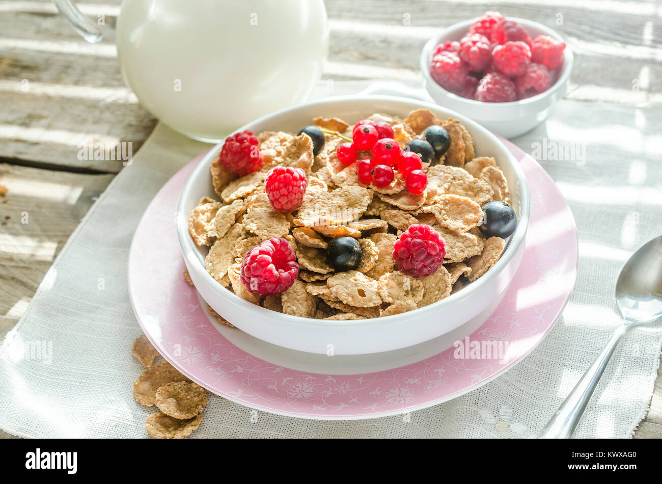 Wholegrain granola with milk and fresh berries Stock Photo Alamy