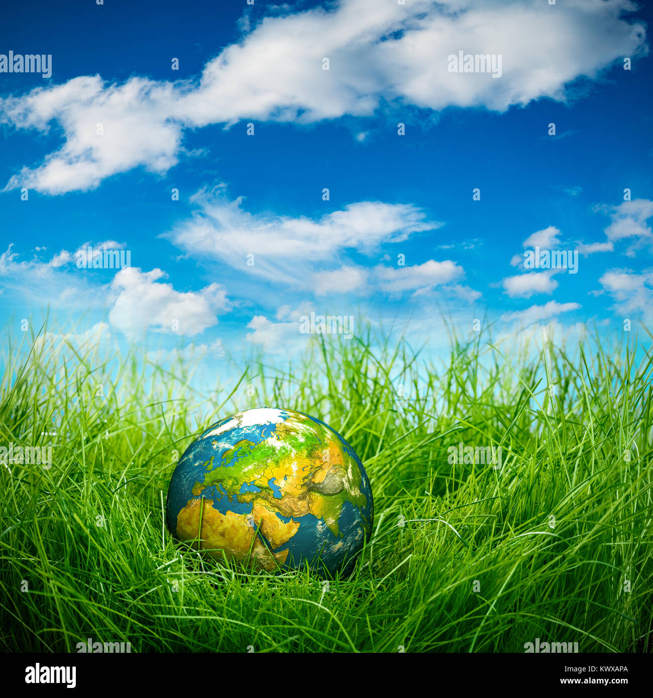 Globe lies on green grass. Concept - Earth Day Stock Photo - Alamy