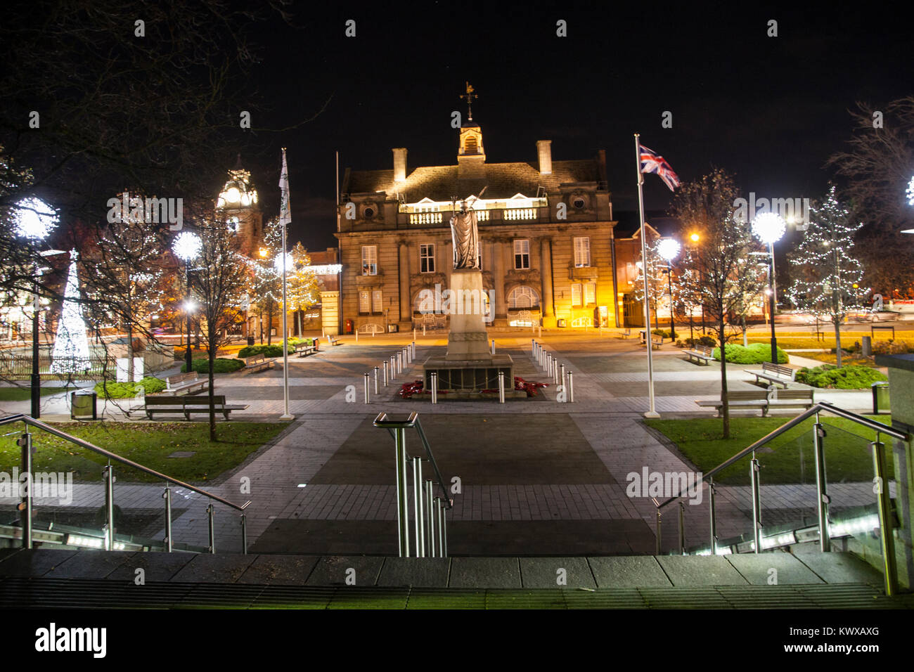 Crewe town center Cheshire floodlit at Christmas time with Christmas tree and lights showing the war memorial municipal buildings also the  town hall Stock Photo