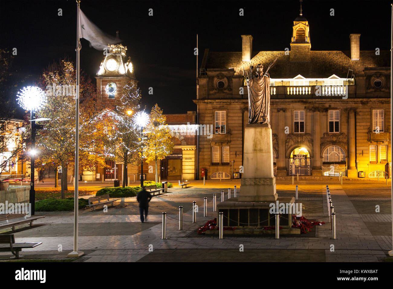 Crewe town center Cheshire floodlit at Christmas time with Christmas tree and lights showing the war memorial municipal buildings also the  town hall Stock Photo