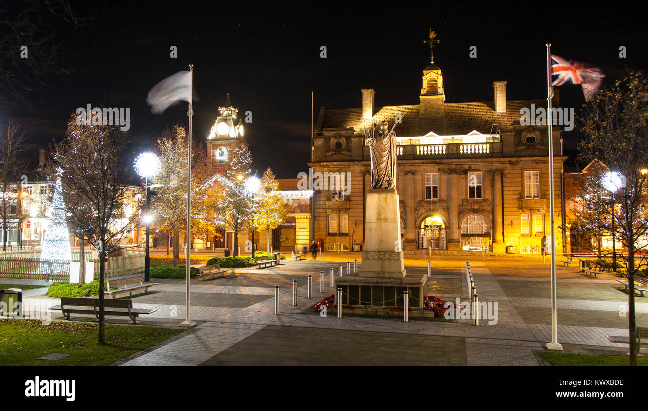 Crewe town center Cheshire floodlit at Christmas time with Christmas tree and lights showing the war memorial municipal buildings also the  town hall Stock Photo
