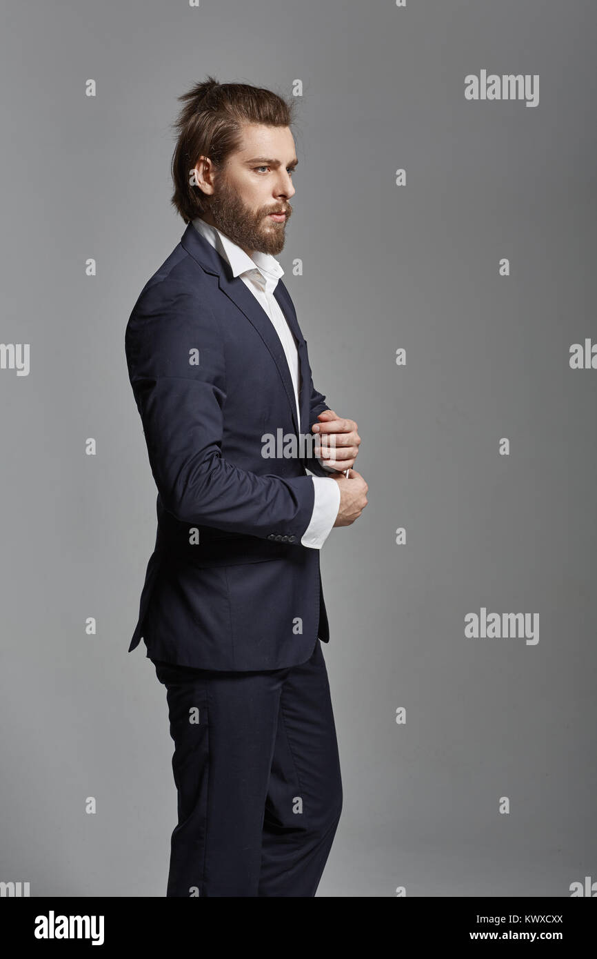 Portrait of a handsome guy wearing suit Stock Photo - Alamy