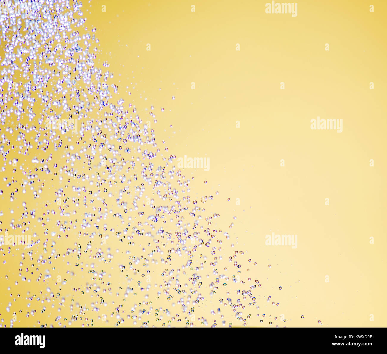 Water drops on a yellow background Stock Photo - Alamy