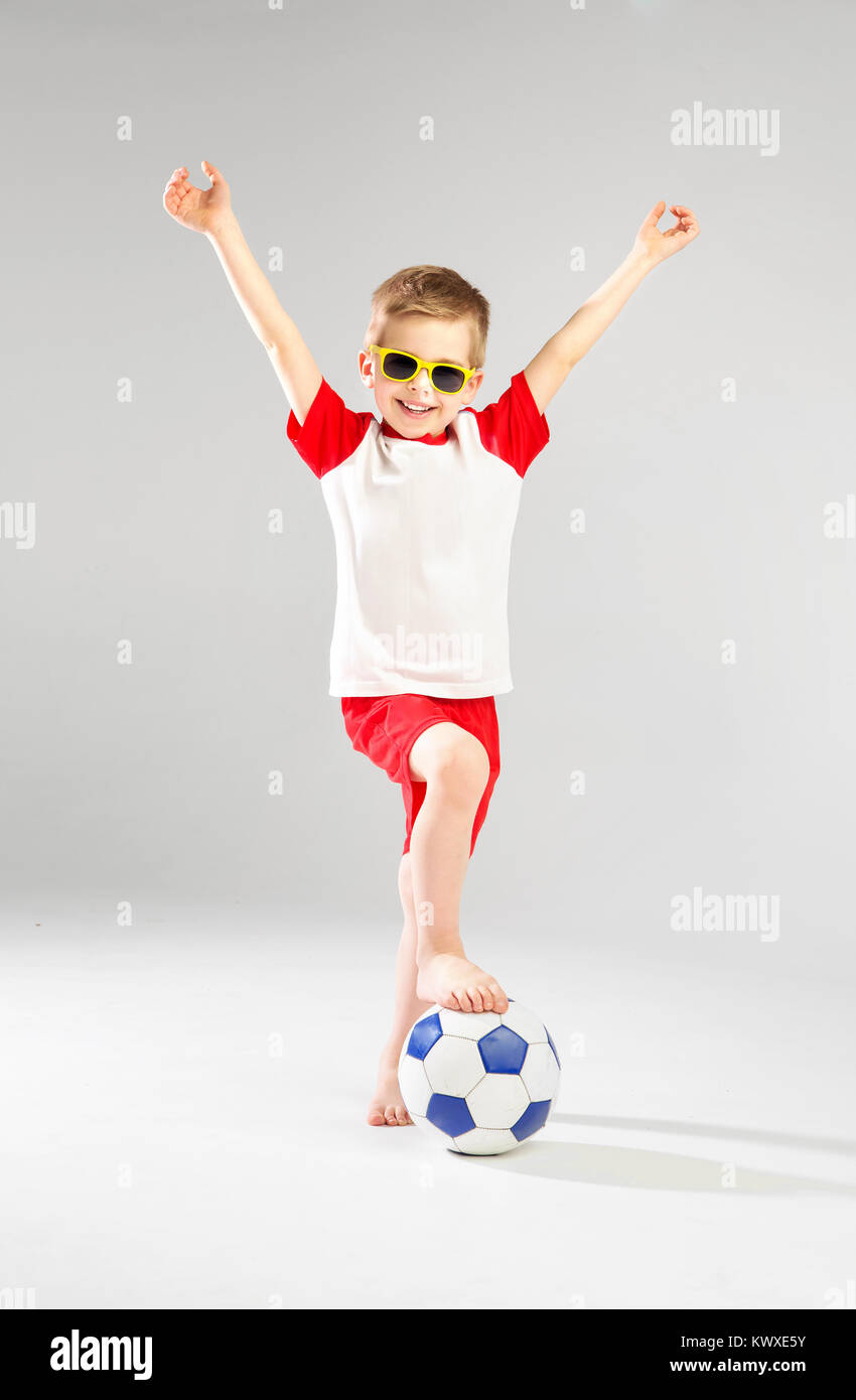 Cute little man playing football Stock Photo