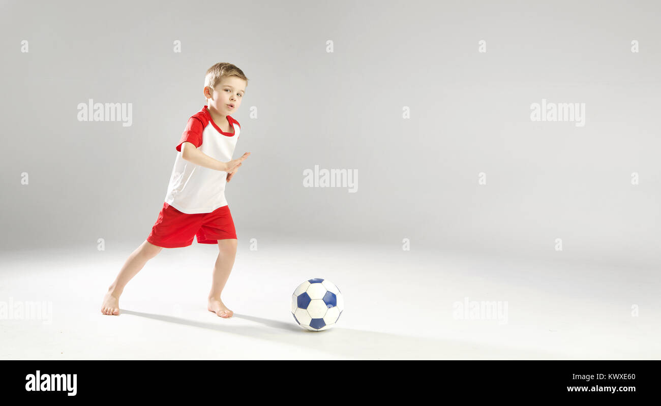 Little talented boy playing soccer Stock Photo