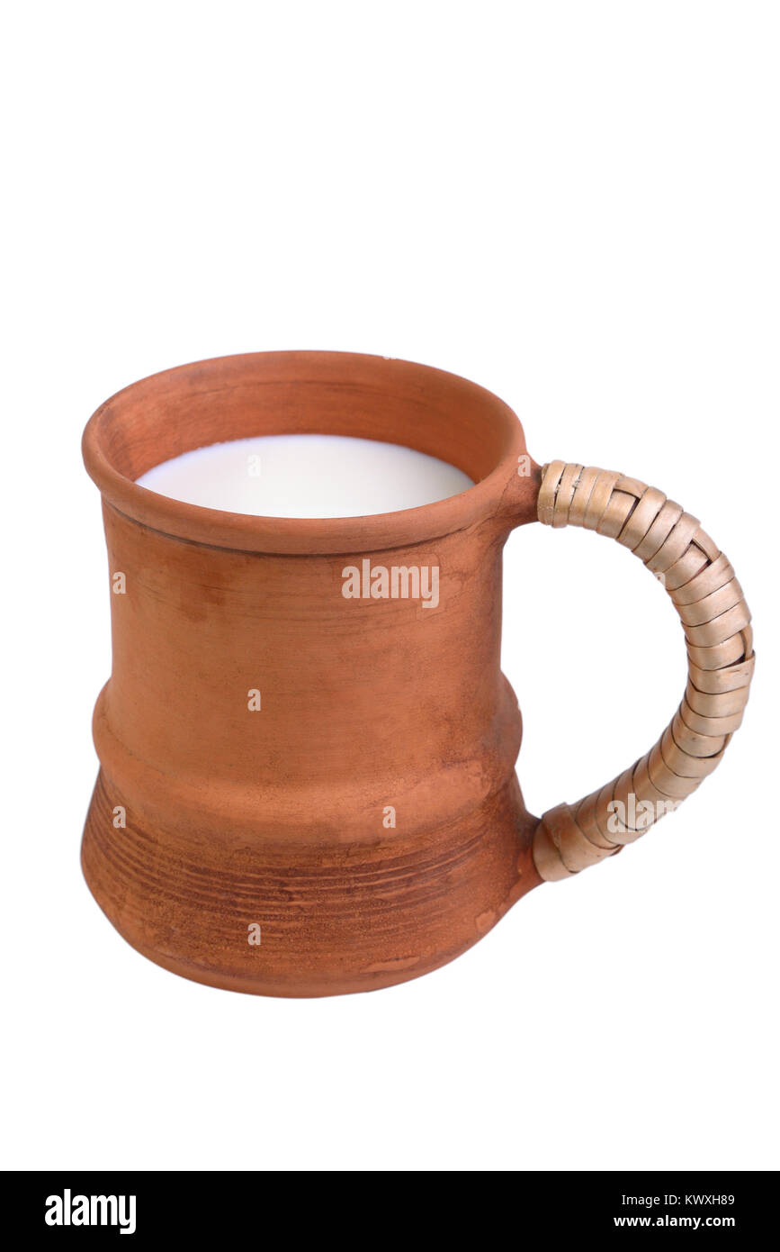 Clay mug with milk isolated on white Stock Photo Alamy