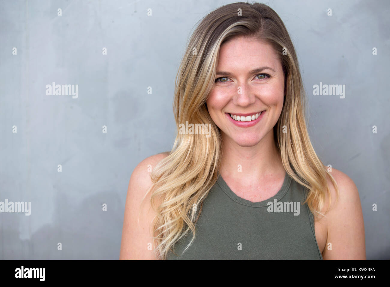 Cute Natural Blonde Woman Smiling With Perfect White Teeth And