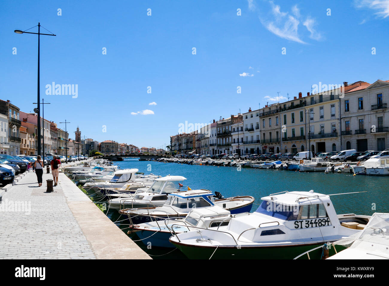 Boats moored along the canal in Sete, Herault, Occitanie, France. A major port on the Mediterranean coast. Stock Photo