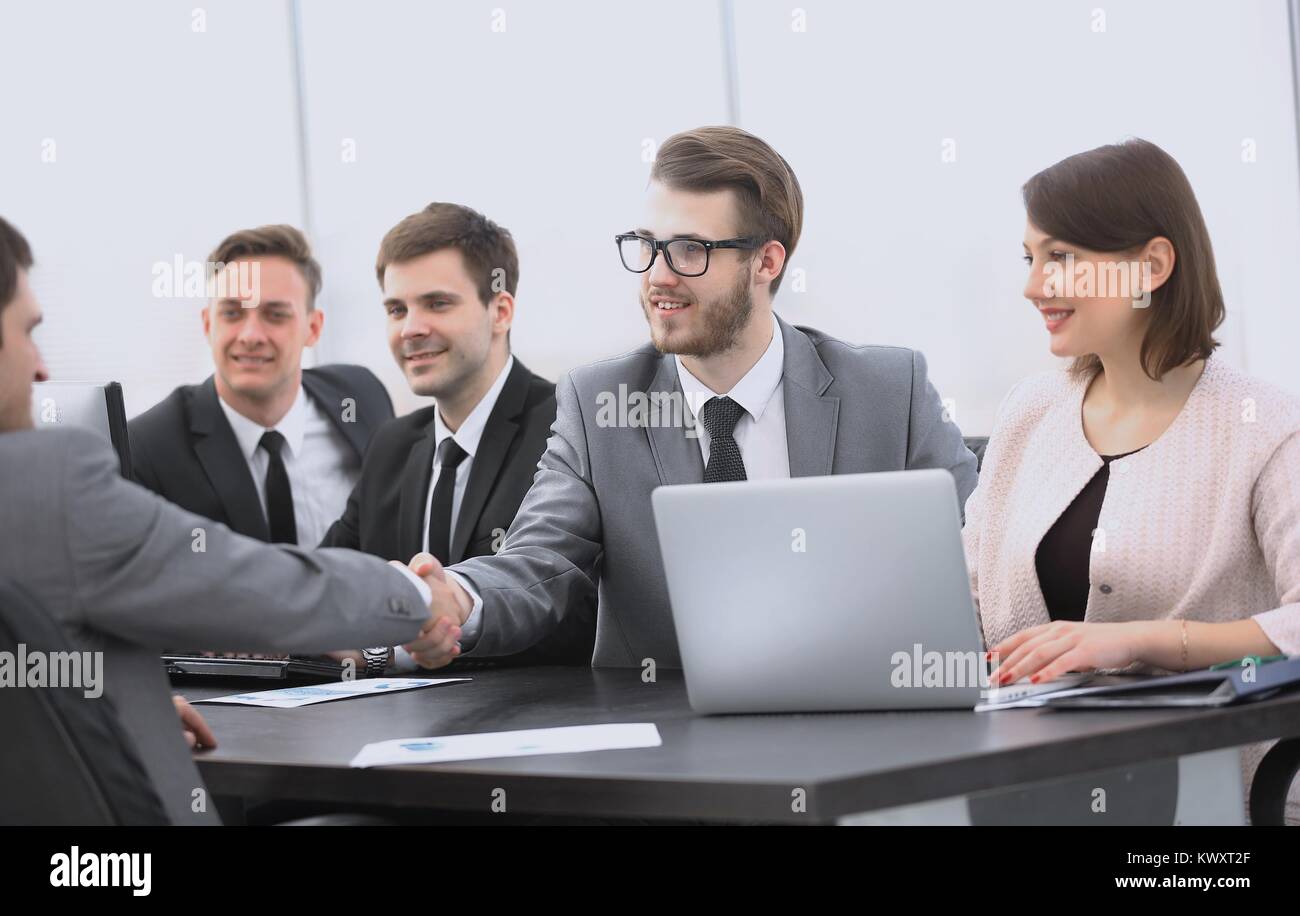 handshake Manager and the client in the office Stock Photo - Alamy