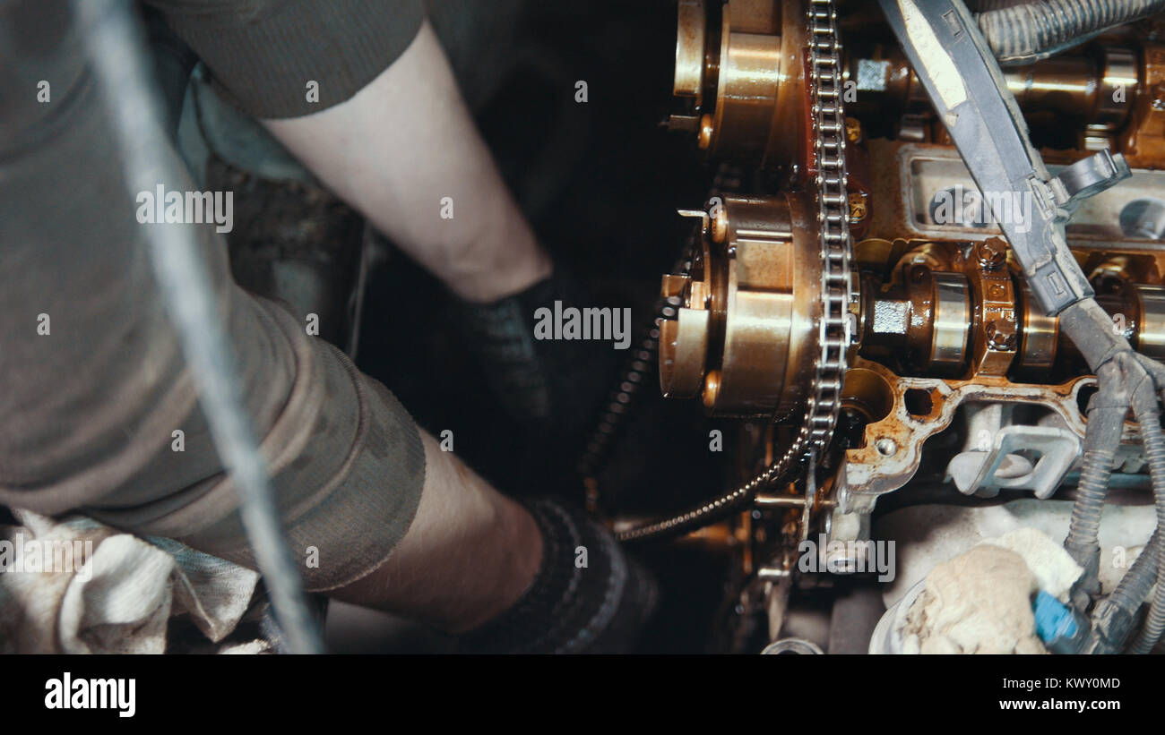 Mechanic cleans and wipes the car engine parts Stock Photo Alamy