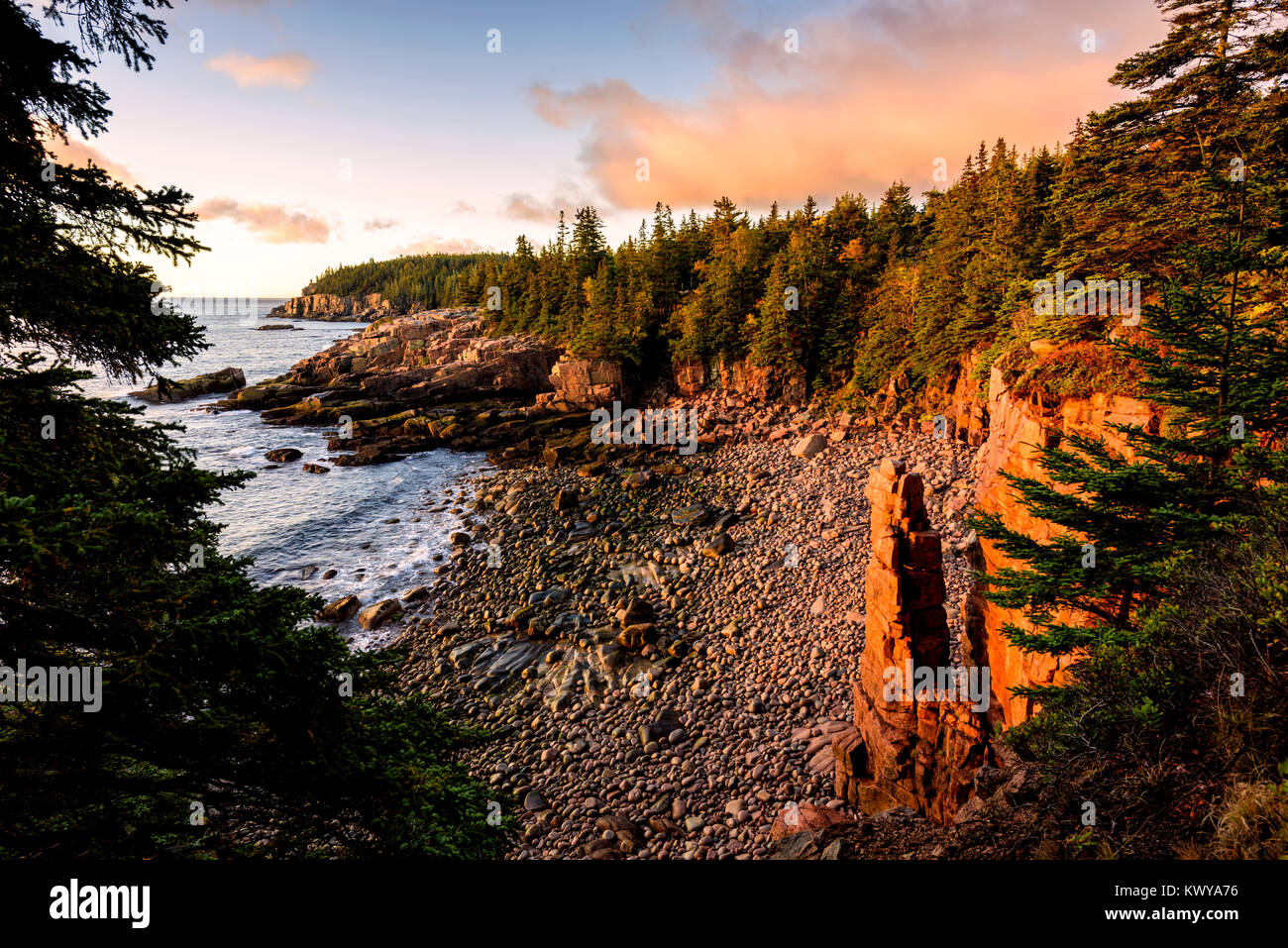 Monument Cove along the Atlantic ocean coast at sunrise in Acadia National Park. Stock Photo