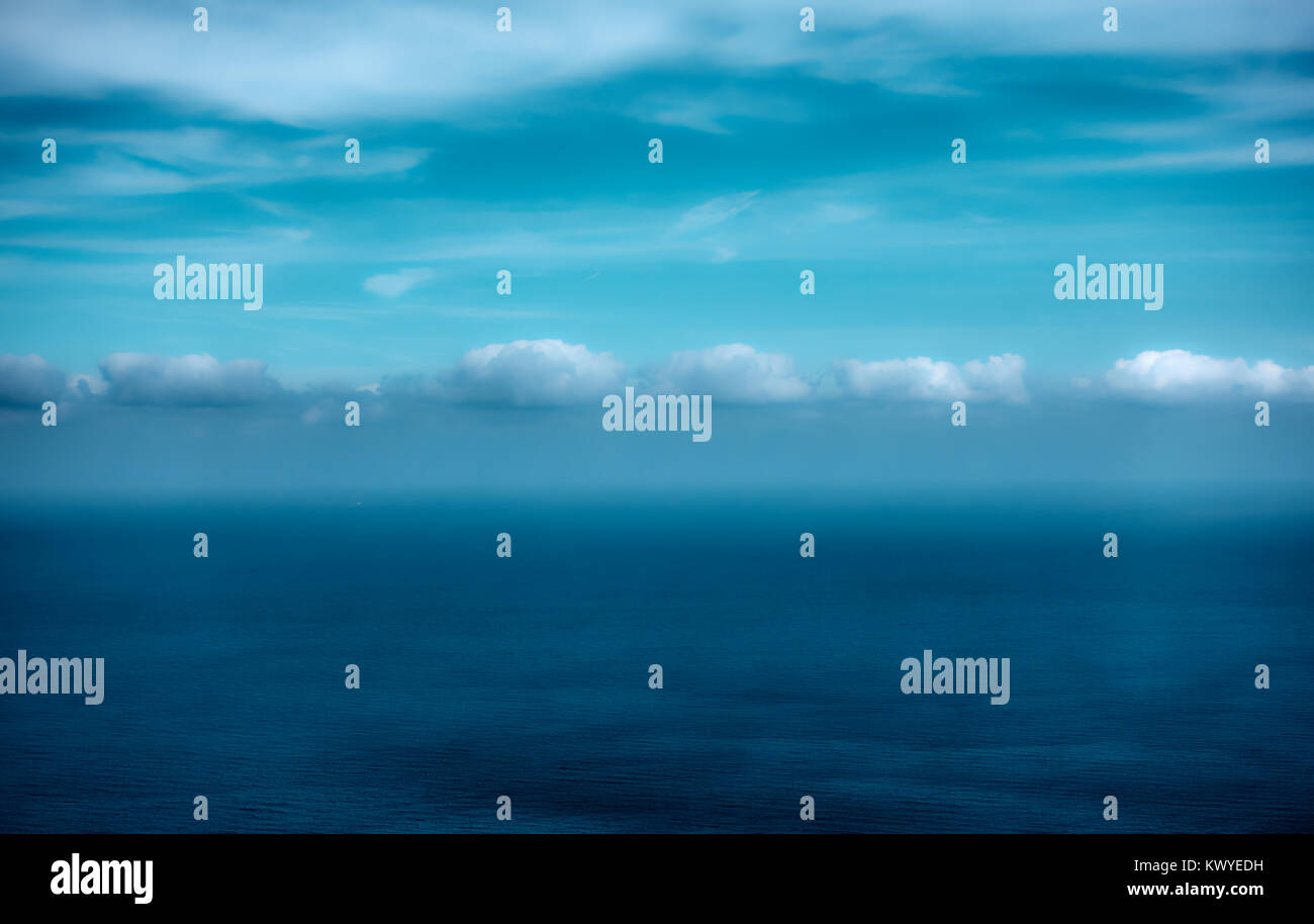 Sea and clouds - surreal seascape with spase for your own text. Filtered image Stock Photo