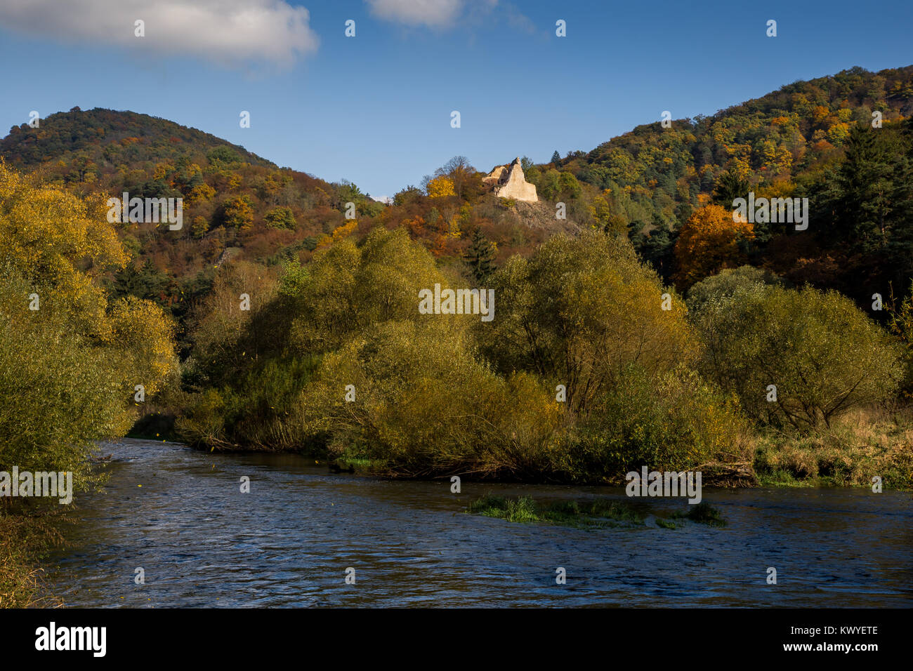 autumn valley with colorful forest and river running Stock Photo