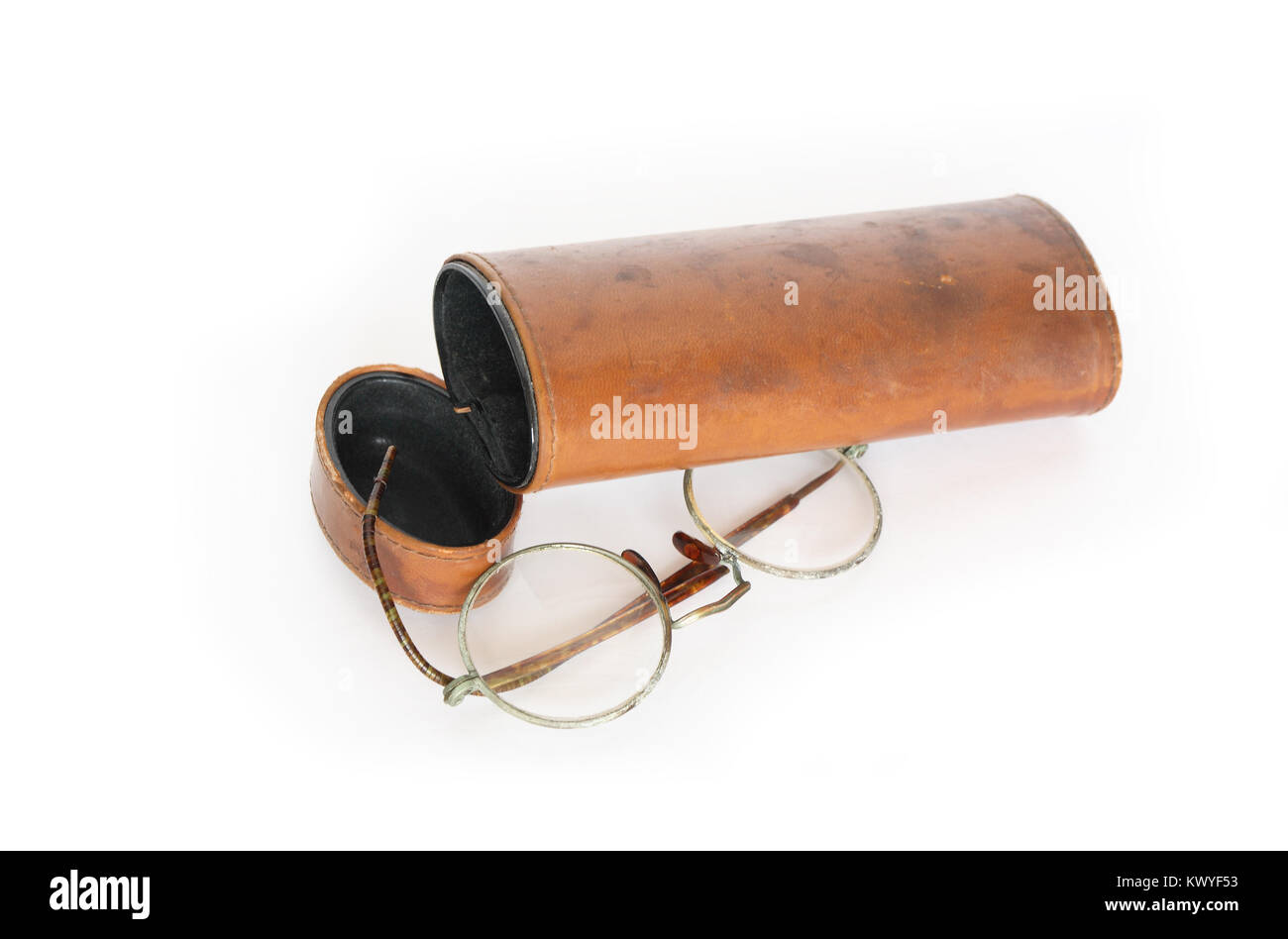 Old spectacles and vintage ginger leather case on white background Stock Photo