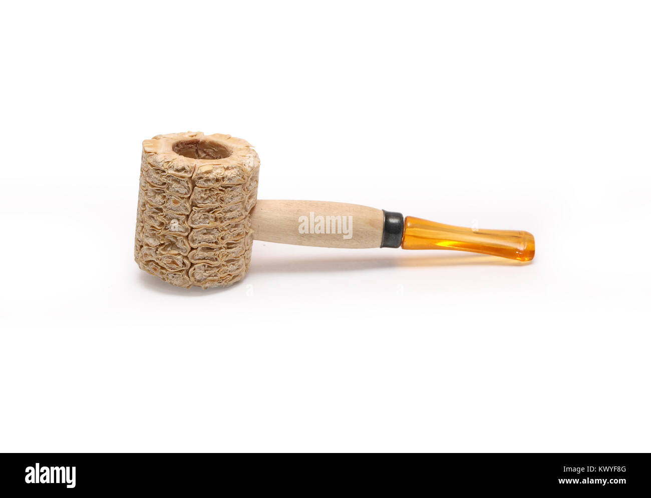 Small tobacco pipe made from corncob isolated on white background with