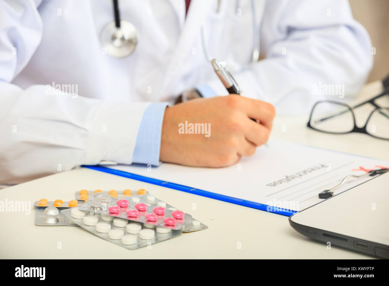 Medical specialist writing prescription doctor hi-res stock photography ...