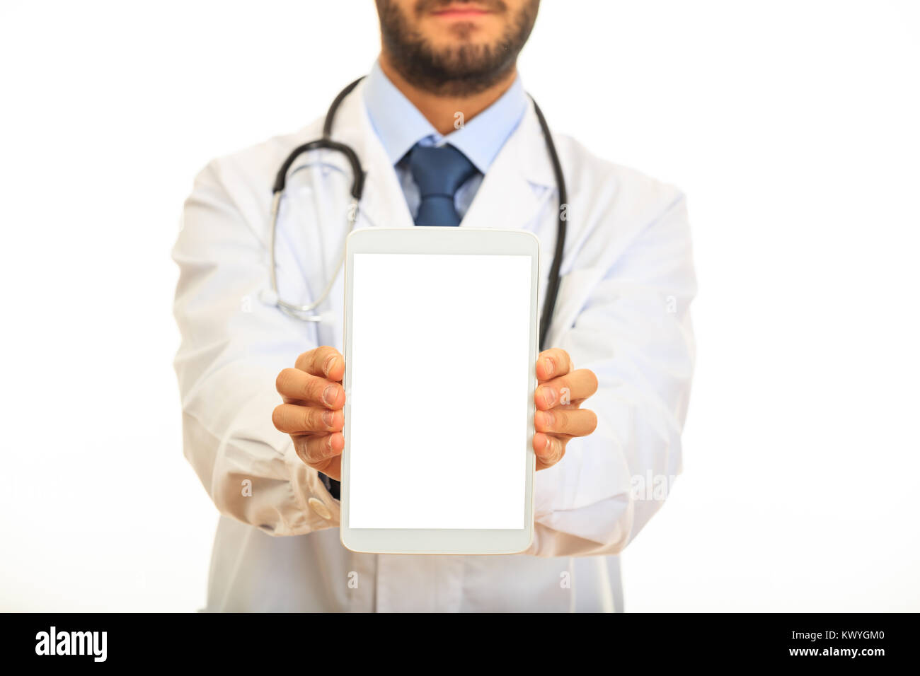 Doctor presenting a tablet on white background Stock Photo - Alamy