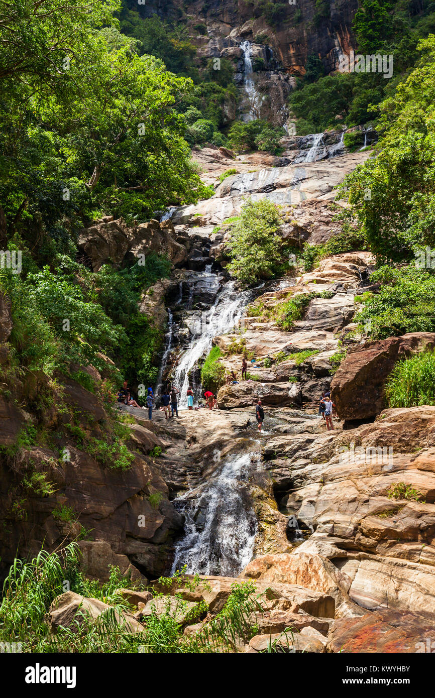 The Ravana Falls or Ravana Ella waterfalls is a popular sightseeing attraction near Ella, Sri Lanka. Ravana Falls ranks as one of the  widest falls in Stock Photo