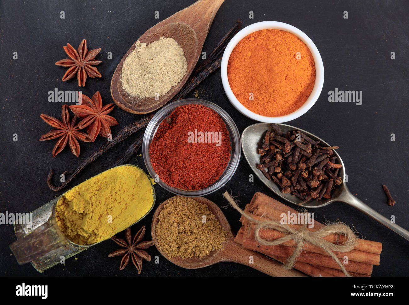 Variety of colorful spices, black background Stock Photo - Alamy