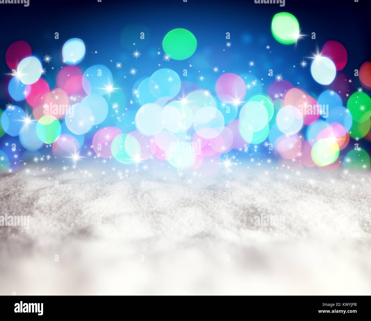 Christmas abstract blue background with snow and lights Stock Photo