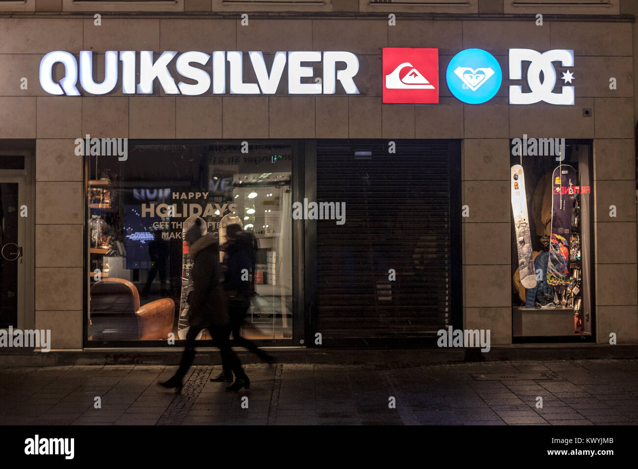 MUNICH, GERMANY - DECEMBER 17, 2017: Quicksliver logo on their Munich main shop taken at night. Quiksilver is an American retail sporting company  Pic Stock Photo