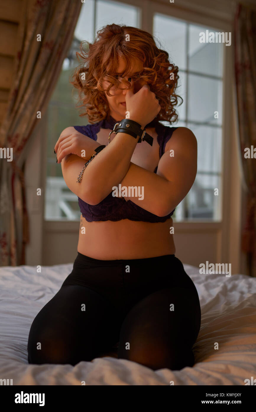 Handcuffed hot women Young Playful Redheaded Woman In Handcuffs In Cozy Country House Interior Stock Photo Alamy