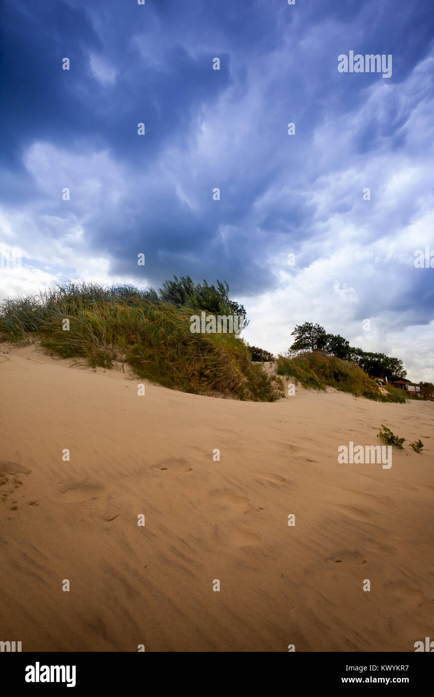 Dark blue sky over  dunes Stock Photo