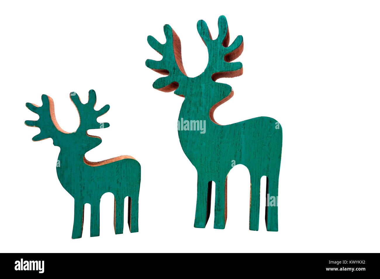 Two wooden cutout ornamental reindeer looking off to right. Stock Photo
