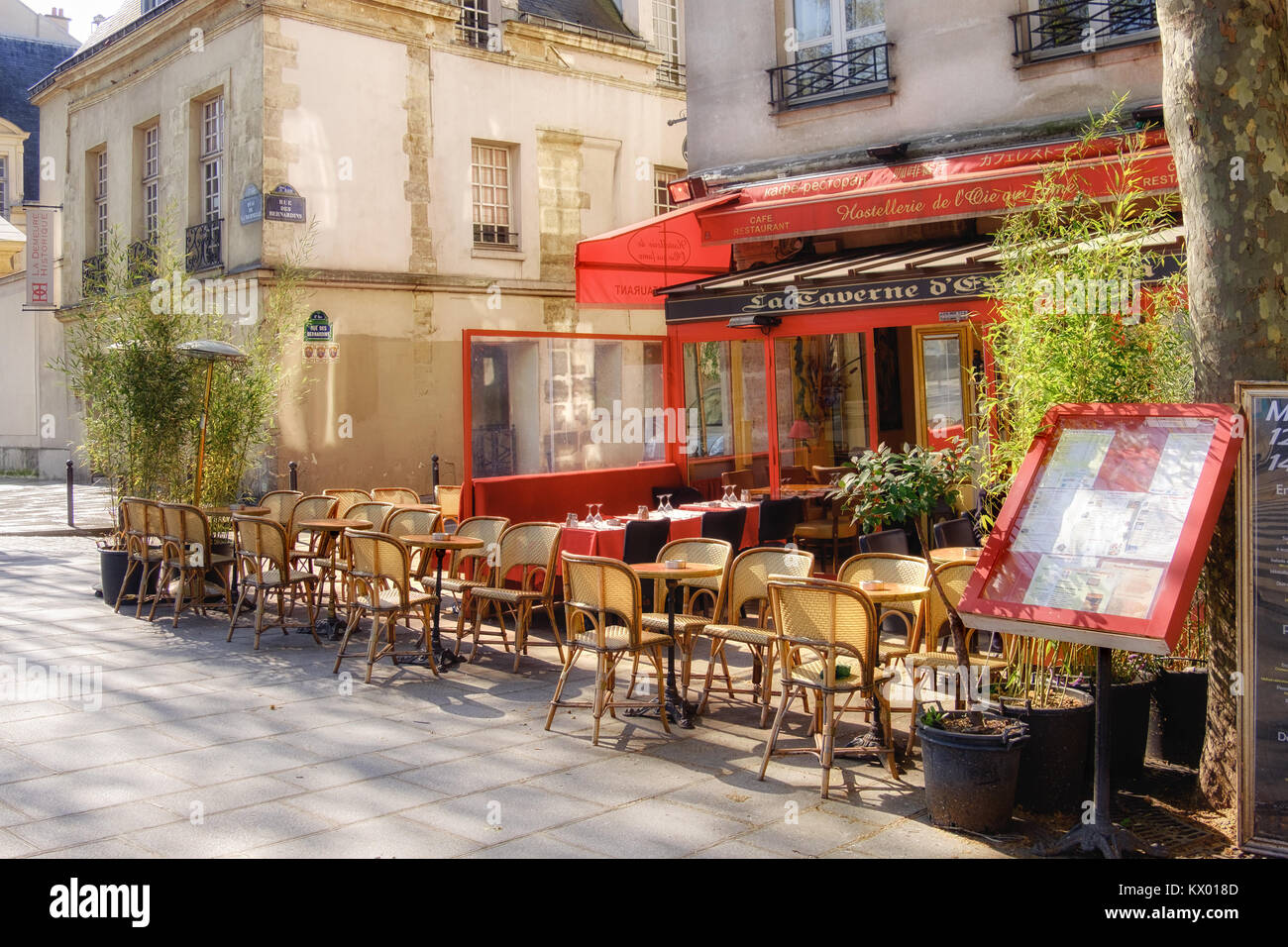 PARIS, FRANCE - APRIL 20 2016: Paris, Latin Quarter.Traditional French restaurant on Quai de la Tournelle waiting for the first visitors. The street i Stock Photo