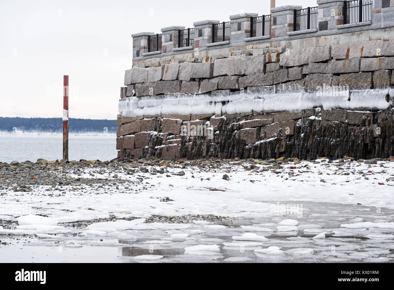 A line of sea ice forms at the high tide line in sub-zero temperatures, Bar Harbor, Maine. Stock Photo