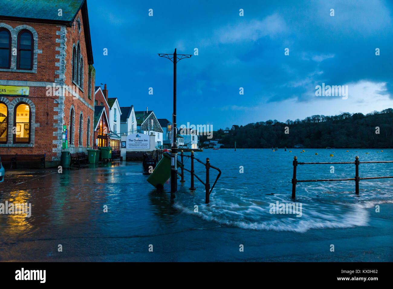 UK Weather & Seasons Fowey Harbour Qauy begins to flood at the break of dawn due to high surf