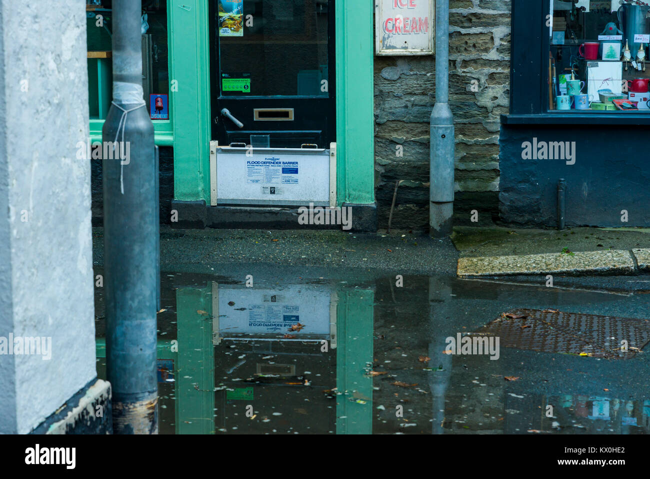 UK Weather & Seasons Fowey Harbour Qauy begins to flood at the break of dawn due to high surf