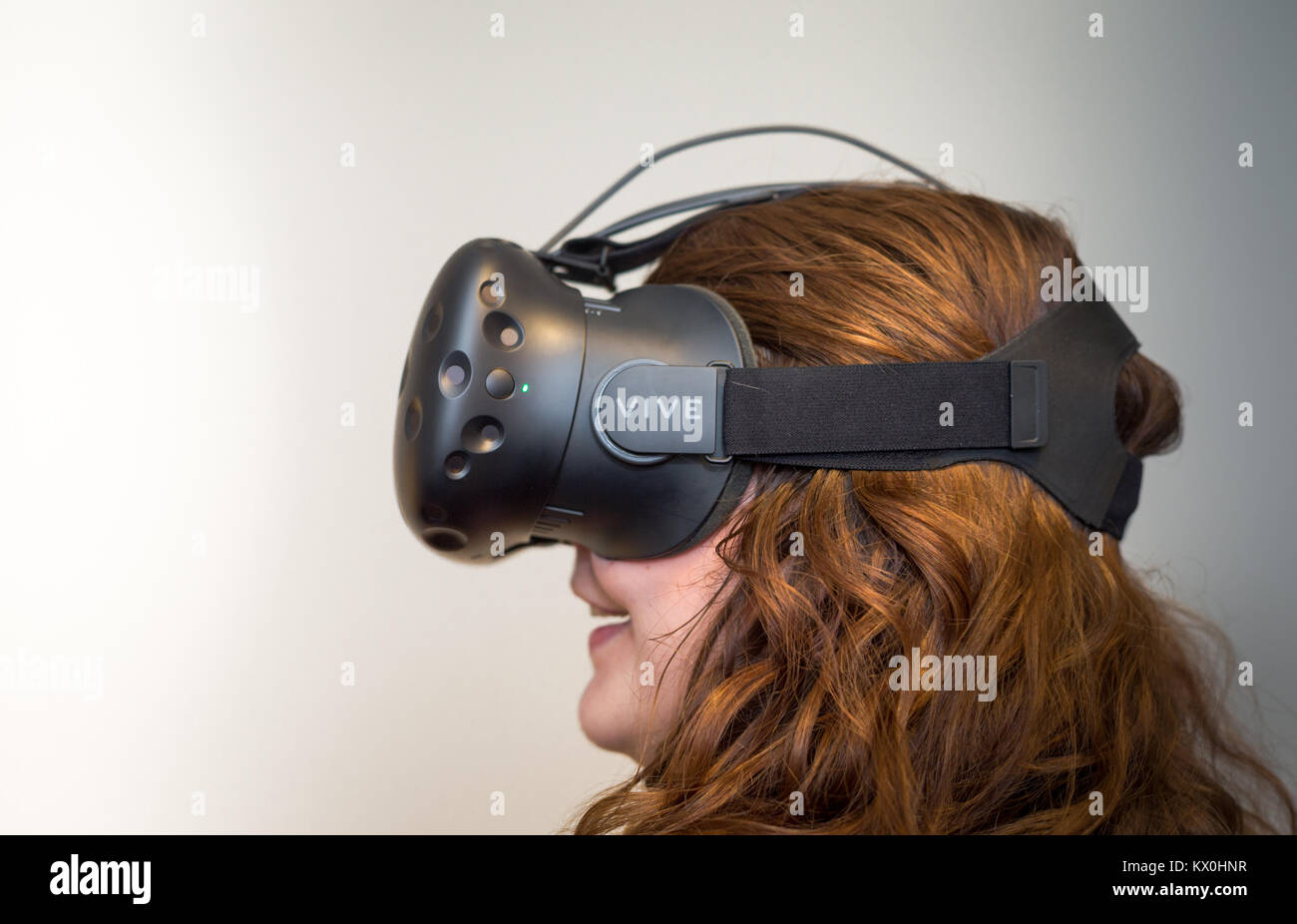 Young woman wearing a VR virtual reality headset Stock Photo