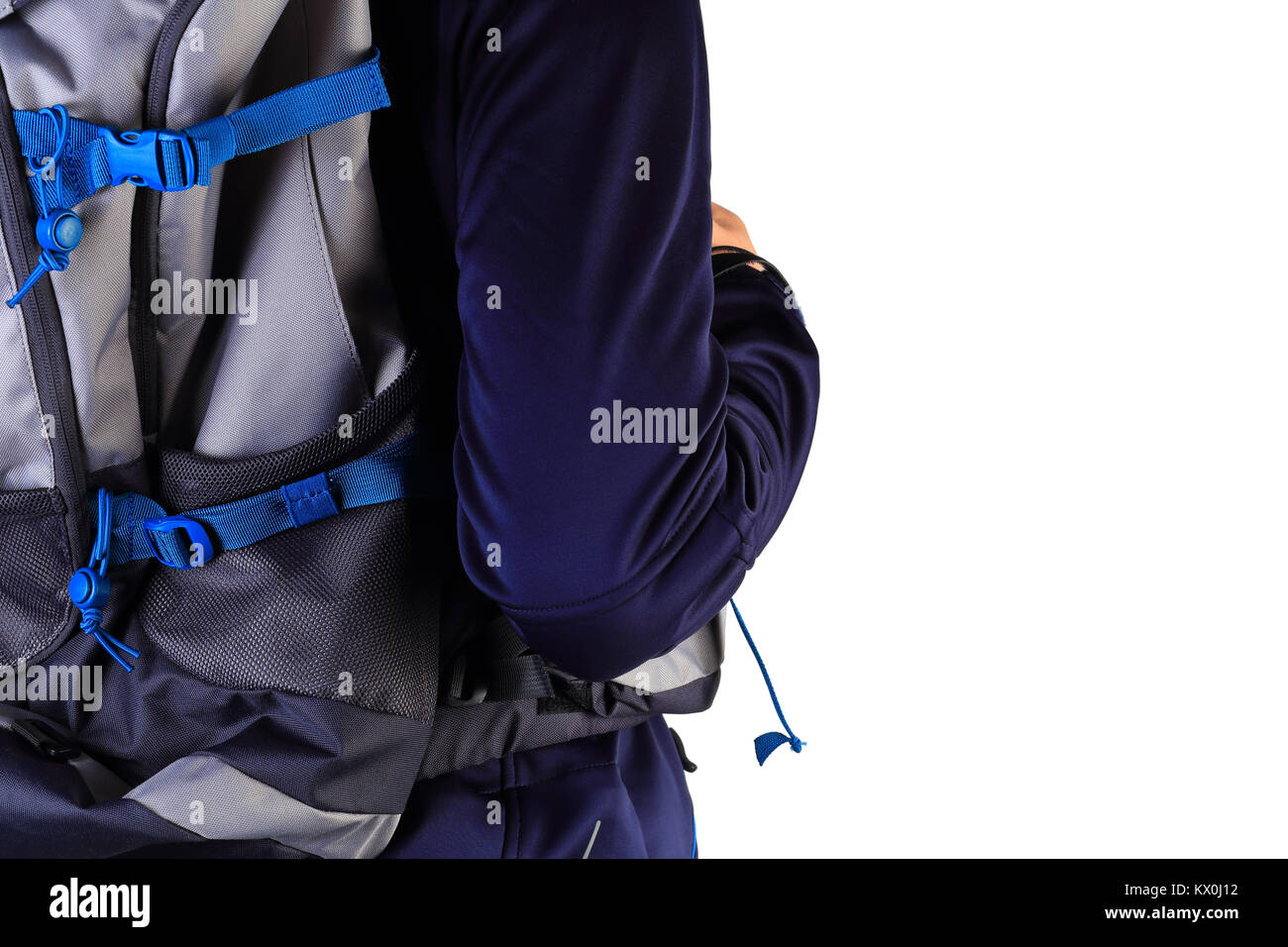 Backpack on man's back closeup. Close-up of tourist isolated on white background. Travel background with free space for text. Stock Photo
