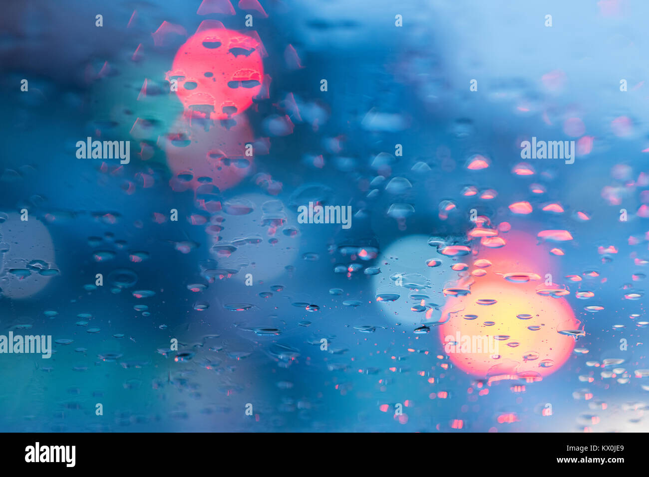 Traffic on street viewed through rainy window of car Stock Photo - Alamy