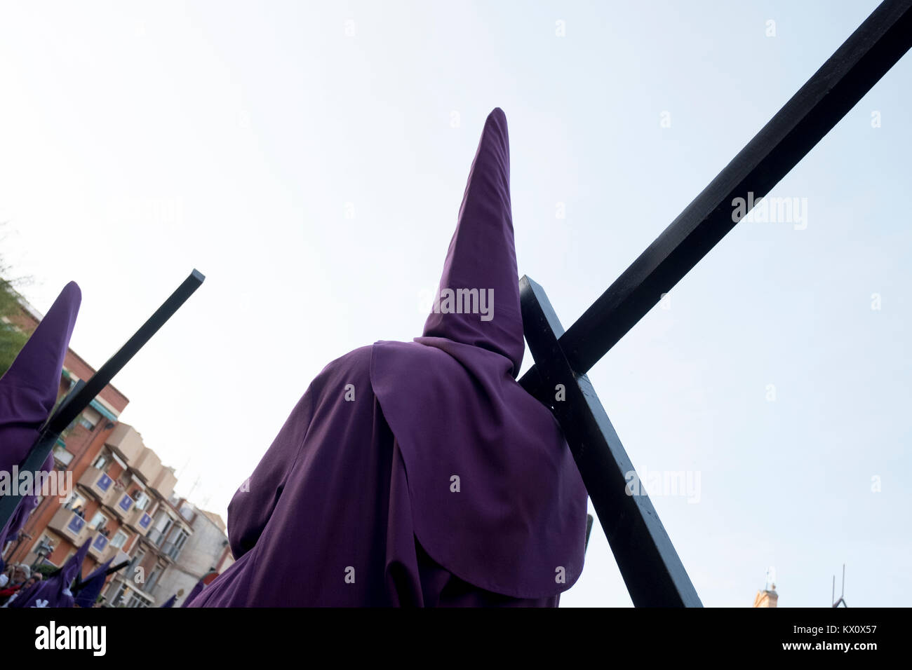 During the Semana Santa ceremonies, penitents carry crosses through the streets of Murcia in Spain Stock Photo