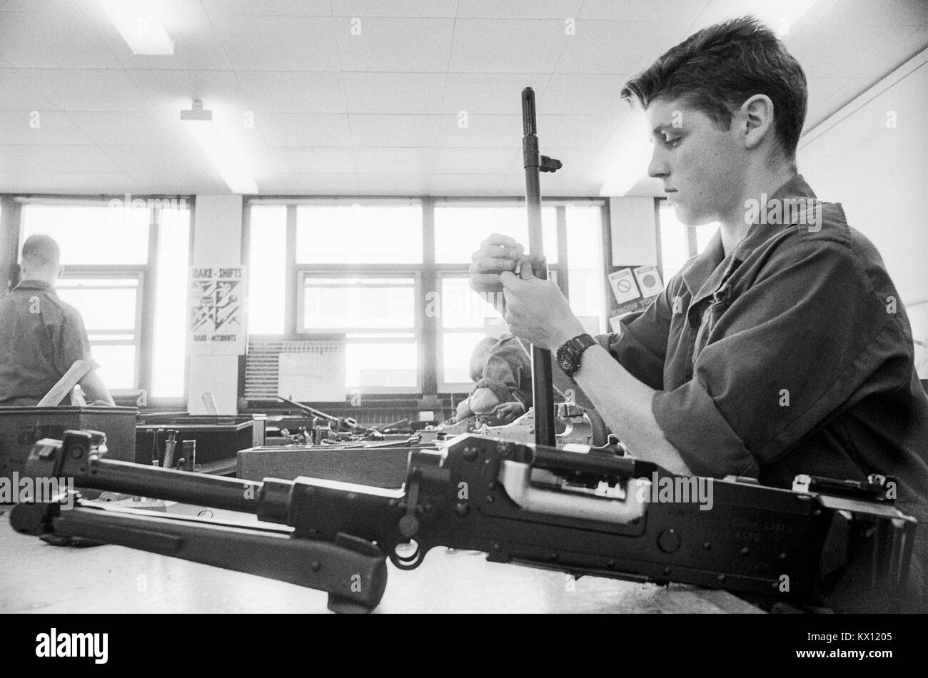 British army squaddies undergoing basic training in a workshop armoury for weapons maintainance training, England, 15th June 1993 Stock Photo