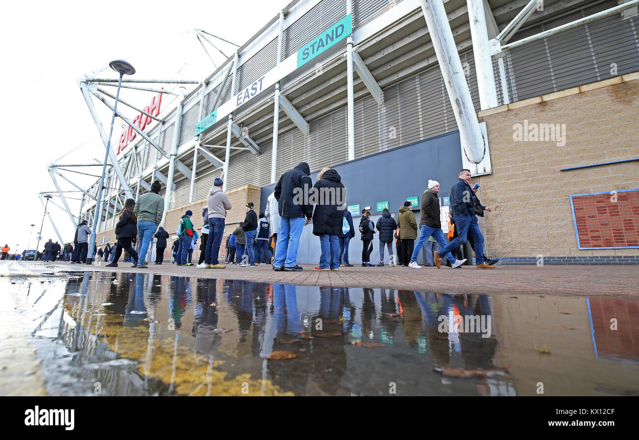 Fans wait for the turnstyles to open for the FA Cup, third round match at the Ricoh Arena, Coventry. Stock Photo