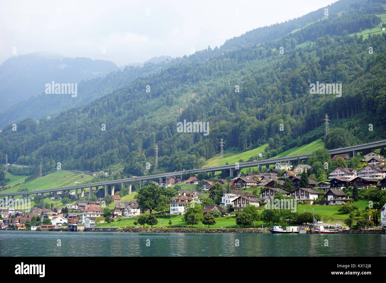 BECKENRIED, SWITZERLAND - CIRCA AUGUST 2015 Highway and town on the lake Lucerne Stock Photo