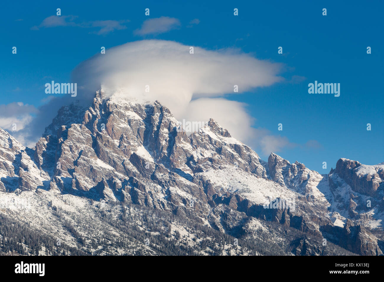 A heavy cloud of fog swirling around the summit of the Grand Teton