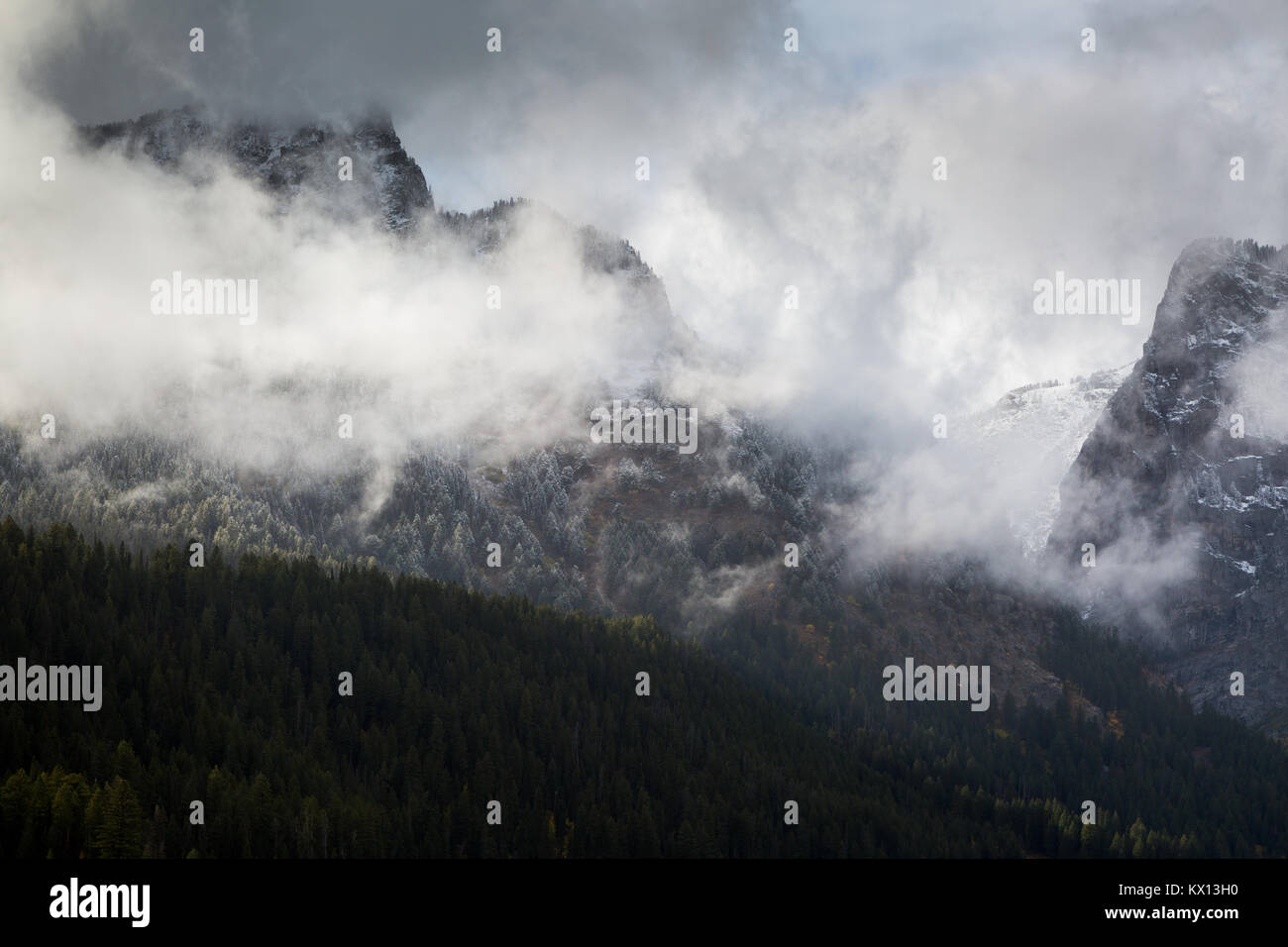 An early winter storm breaking up leaving small areas of fog around Death Canyon of the Teton Mountains. Grand Teton National Park, Wyoming Stock Photo