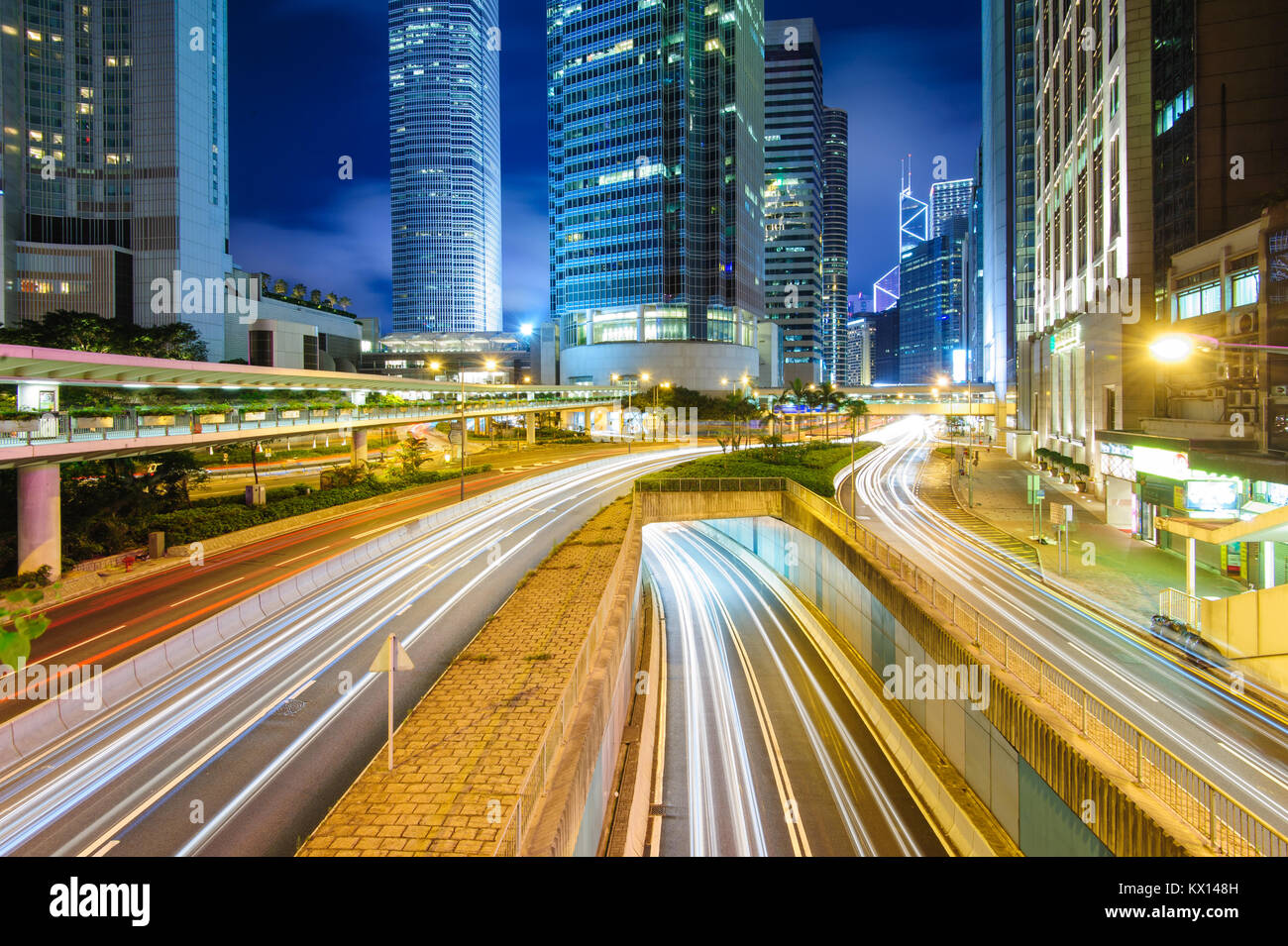 night view of Hong Kong with traffic trails Stock Photo