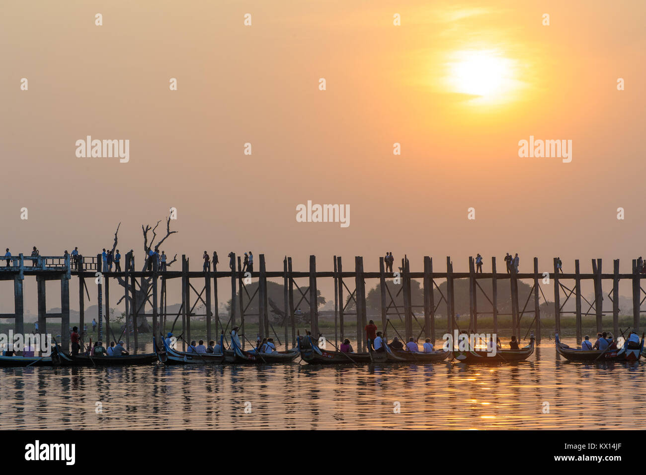 Sunset with silhouette of u bein bridge in myanmar Stock Photo - Alamy