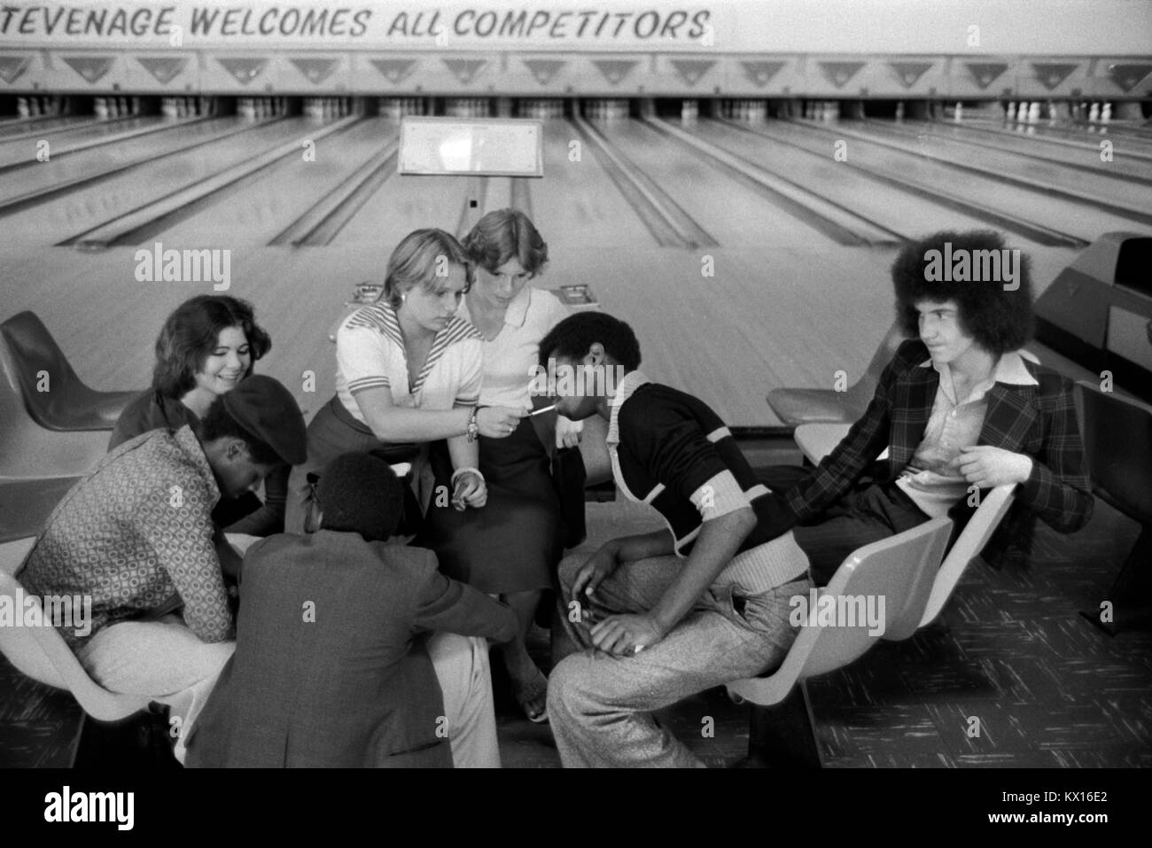 Black British boys and white girls, a group of teenagers hanging out in bowling alley Stevenage